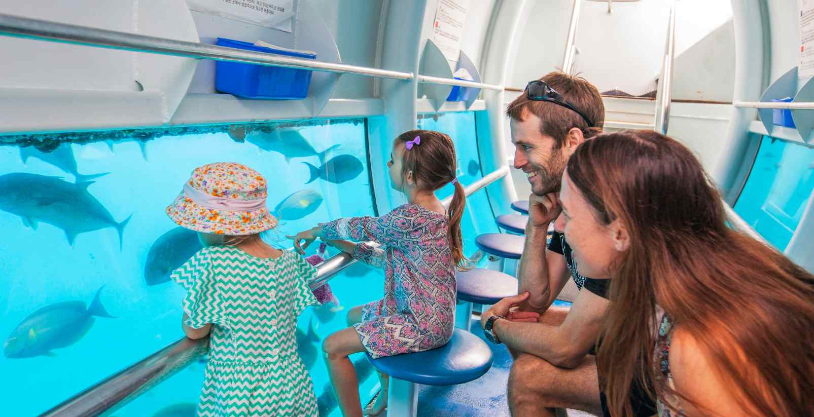 family in glass bottom boat